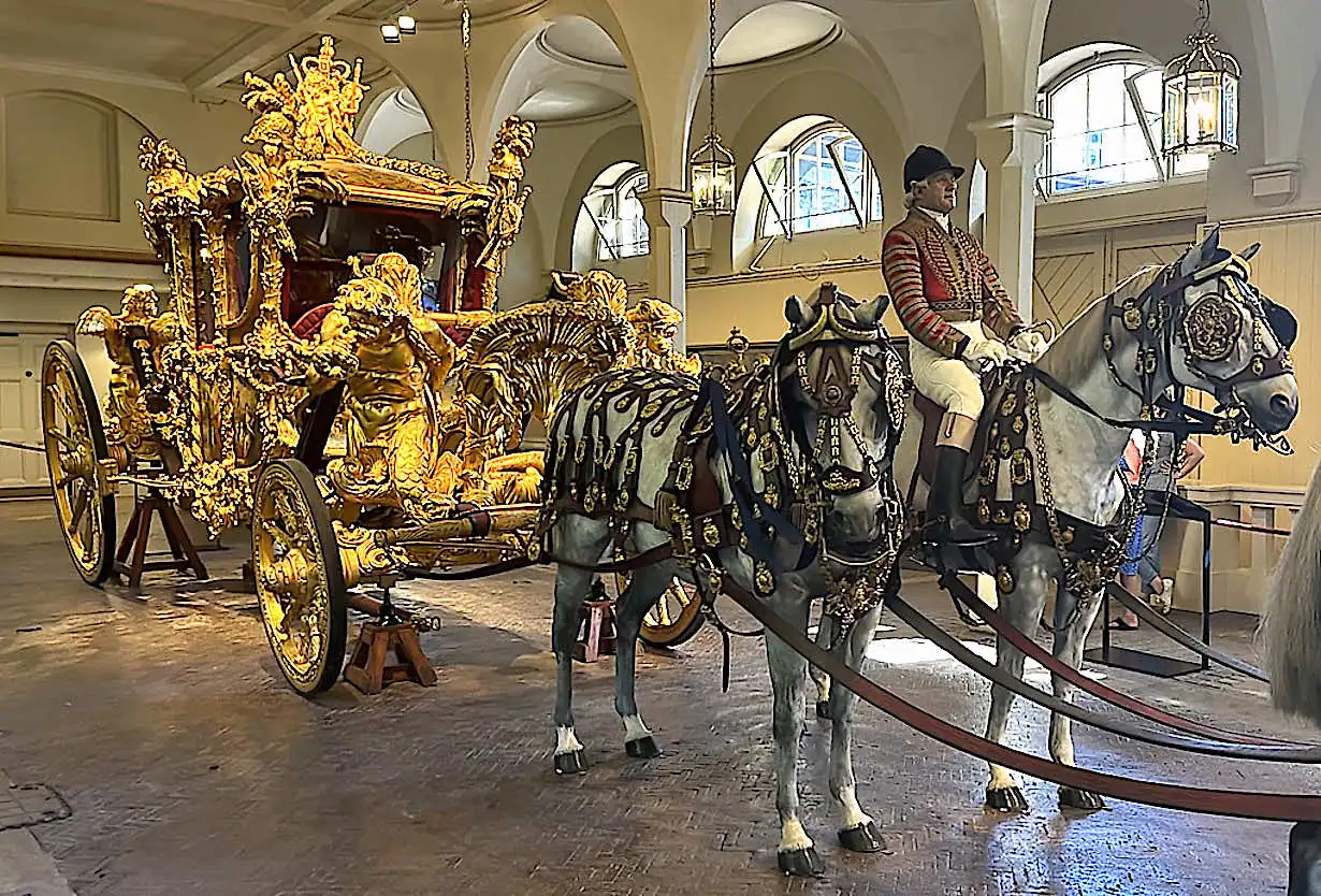 The Gold State Coach and horse riders
