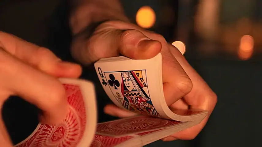 Magician Jake Banfield performing a card trick
