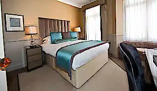 St James’s Hotel and Club Hotel bedroom